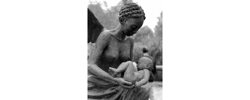 Black and white photograph of a statue of mother and child from the Whitney Plantation