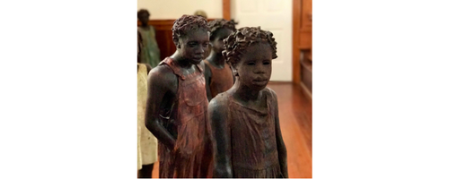 Sculptures of African American young women from the Whitney Plantation