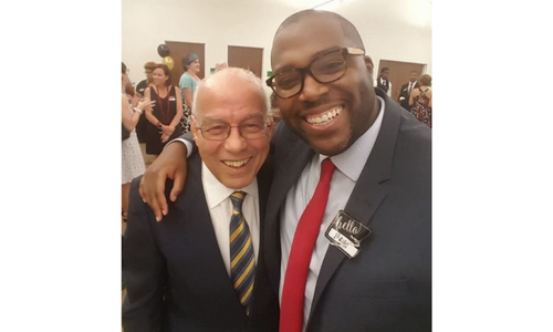 Brian Johnson ’02 poses with President Emeritus Norman C. Francis ’52.