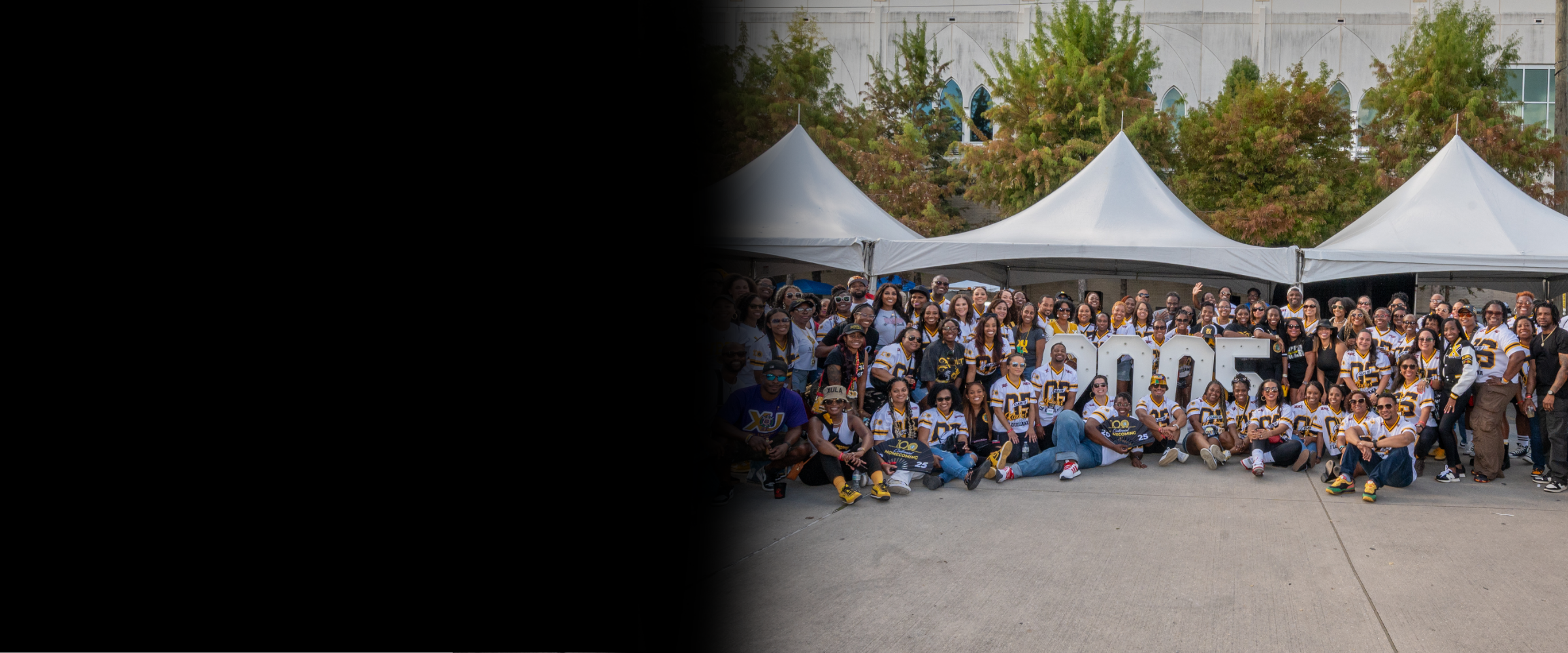 The Class of 2005 poses during Homecoming 2025 in custom jerseys by a licensed vendor.