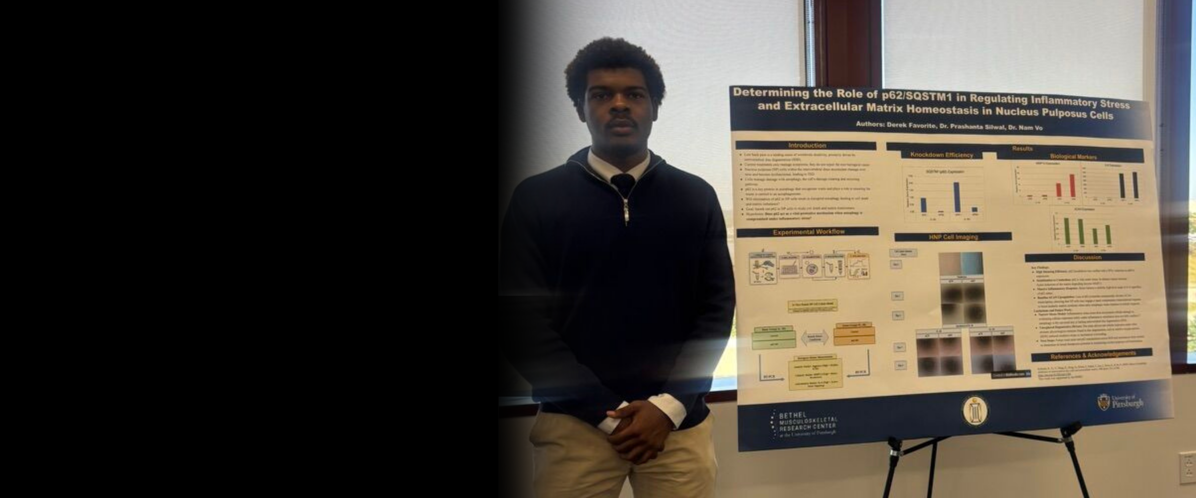 Derek Favorite standing with research poster