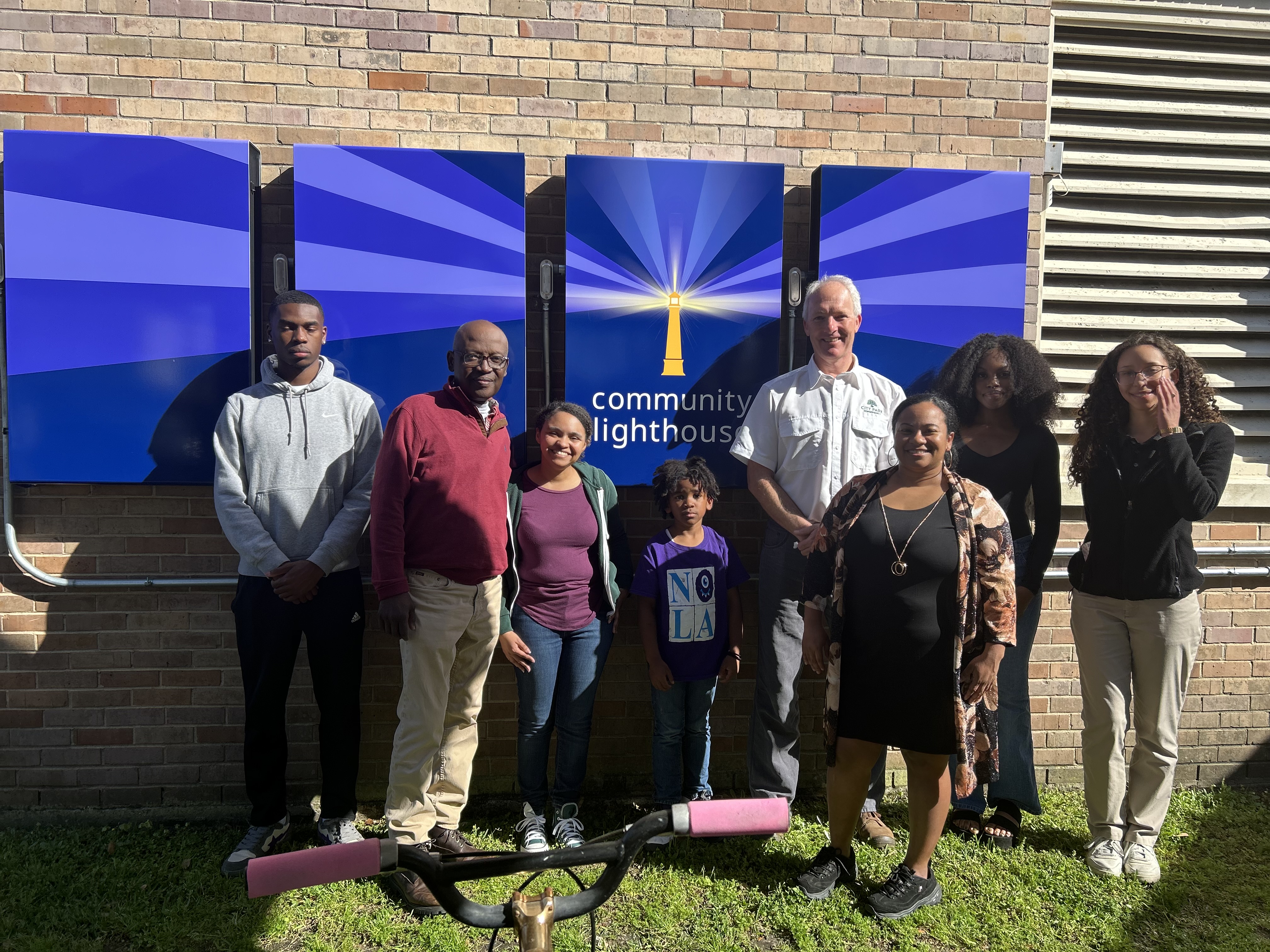 PHOTO: L to R: DeMarquis Milton, Garrett Johnson, Asia, Maximillion Sargent, Jake Webster, Dr. Cassandra Shepard, Braniya McQueen, Katelin McWilliams on a field trip for a directed studies course to a community lighthouse at First Grace United Methodist Church to examine their solar energy microgrid for storm resilience. 
