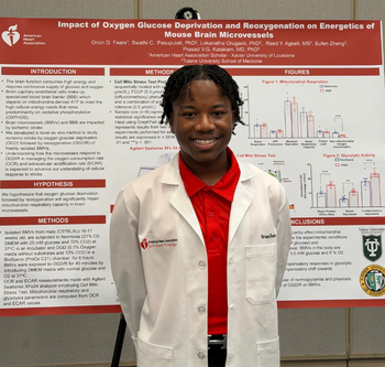 Orion Fears standing with a poster displaying his research work